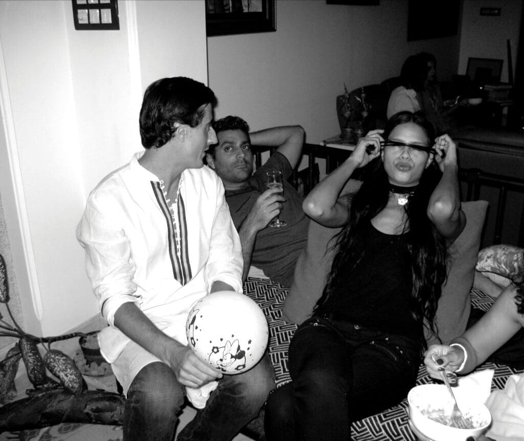 Mumbai creatives | a black and white photograph of friends at a party in Mumbai