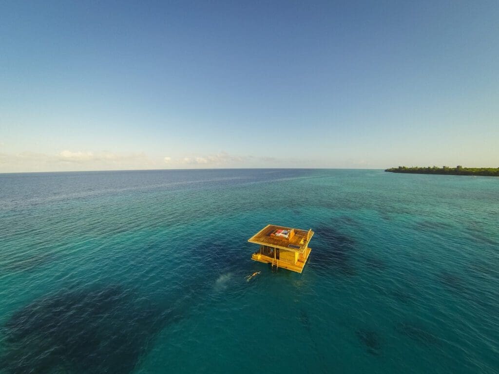 Regenerative travel | a room anchored in the ocean by Manta resort on Pemba Island, Tanzania