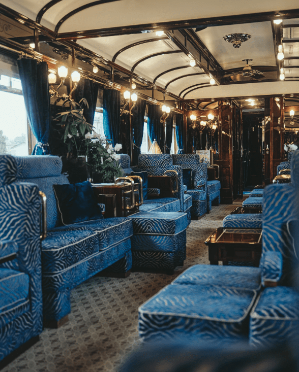The best European trains | interior view of a Belmond train with vintage velvet furnishings