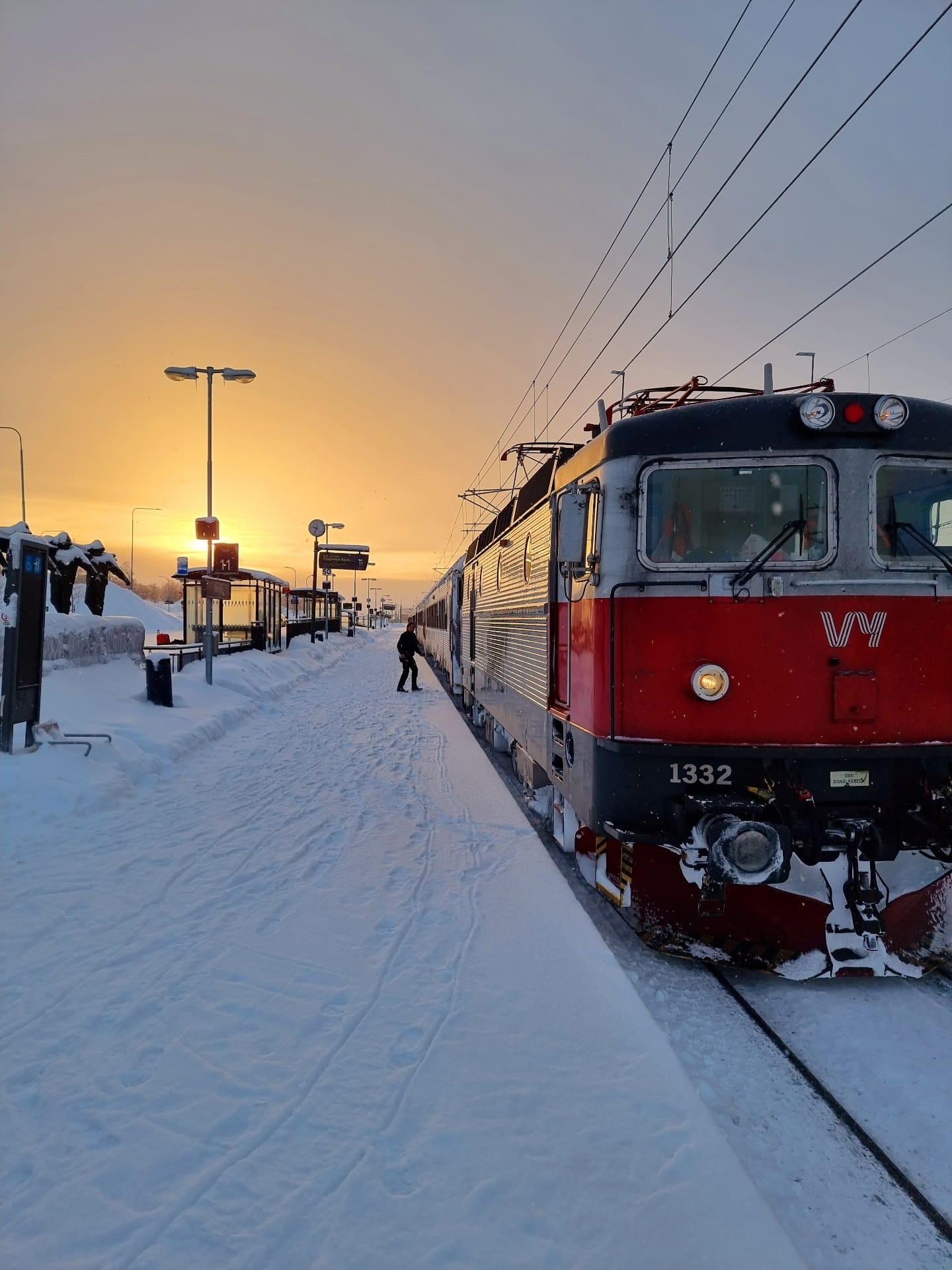 A winter train ride from Stockholm to Narvik beneath a setting sun, with snow underfoot