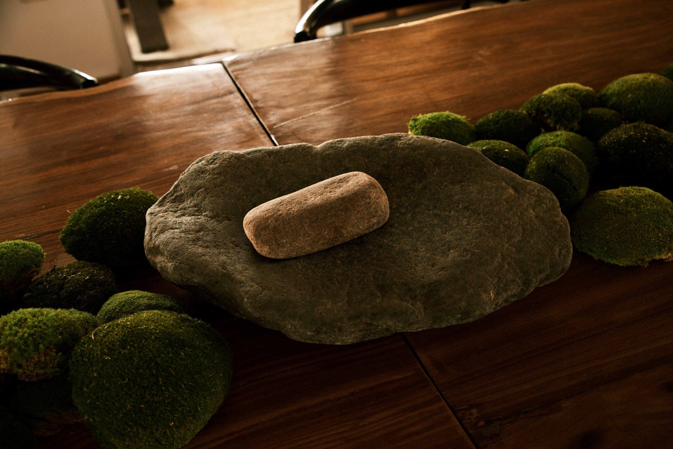 A traditional stone used to grind pepper and other herbs in Nigerian cuisine, on display at Ìtàn Test Kitchen.