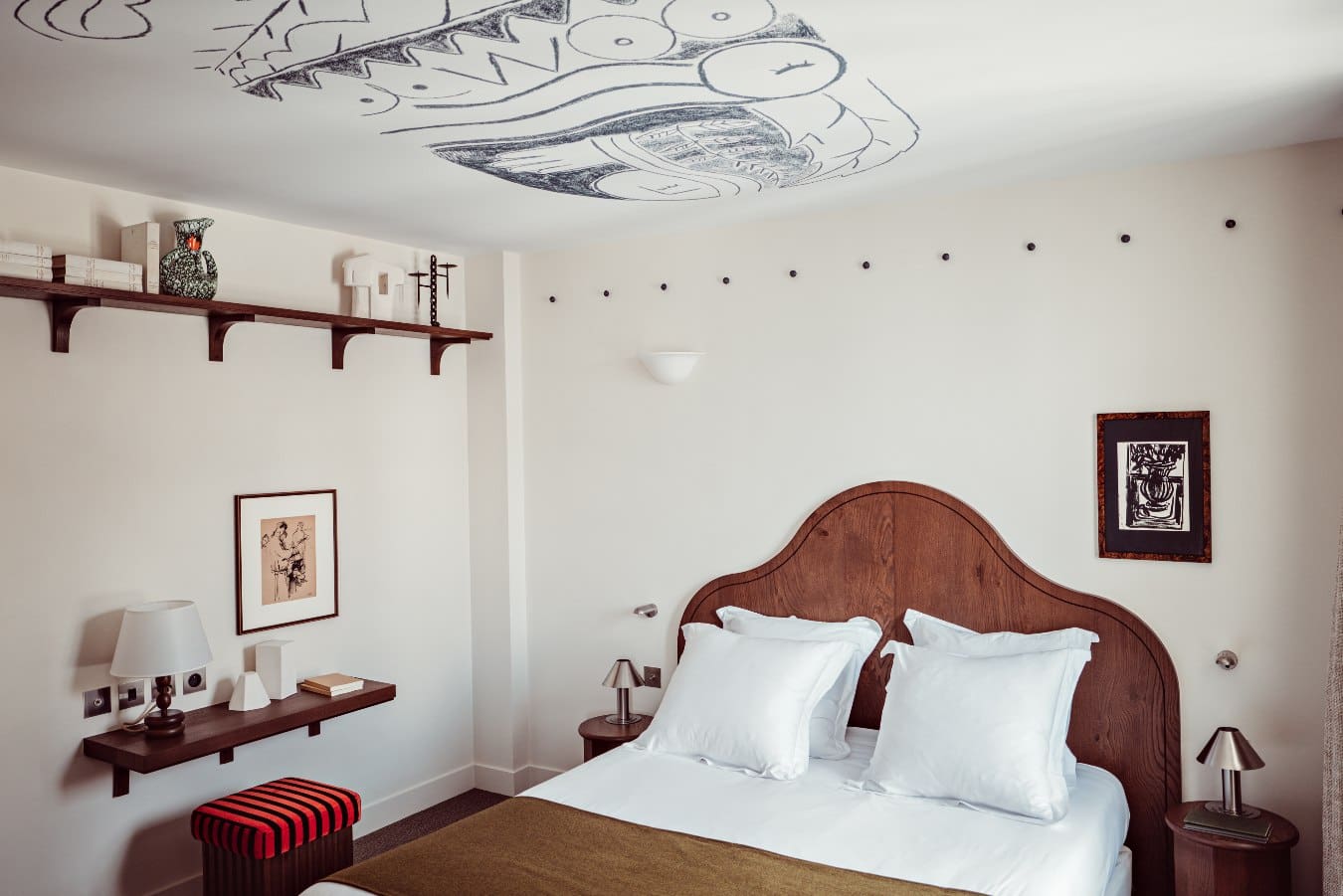 At Hôtel des Academies et des Arts in Paris, Franck Lebraly’s expressive sketches cover bedroom ceilings