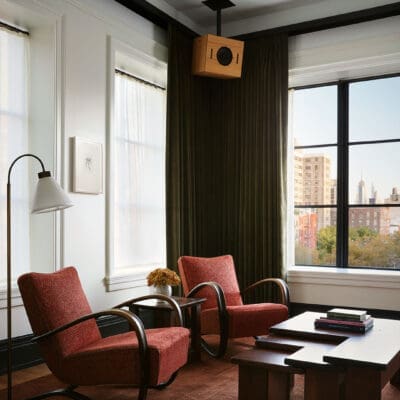 The best hotels in New York | cranberry-toned chairs at the Nine Orchard hotel