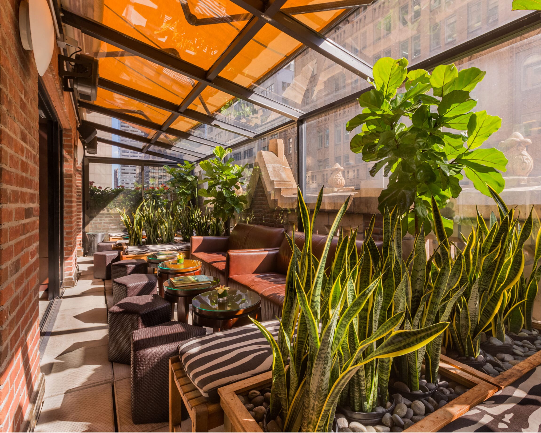 The best hotels in New York | A secluded terrace at The Library Hotel with an orange overhang
