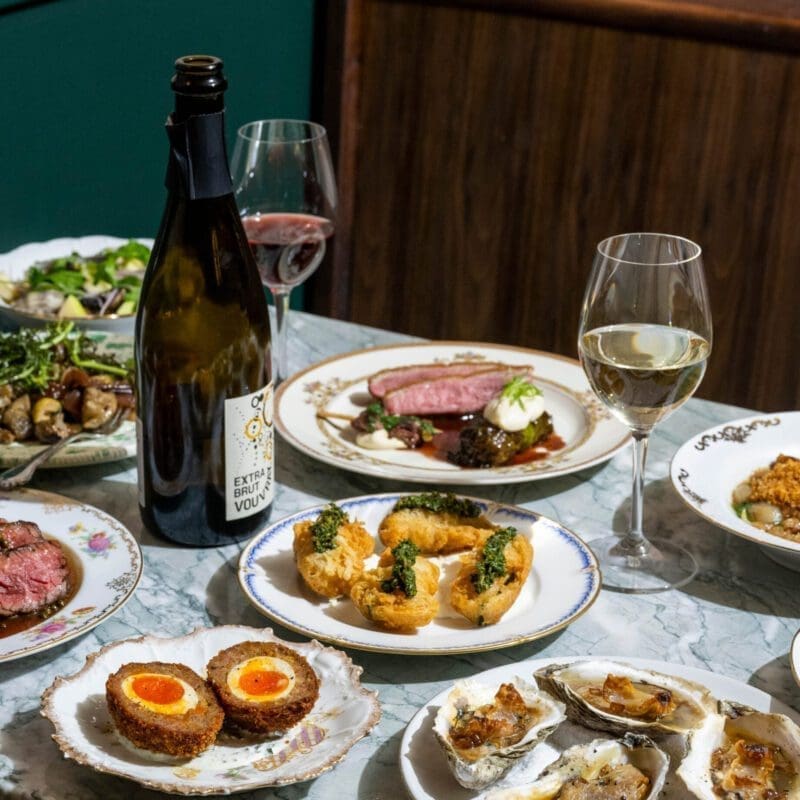 The best restaurants in New York City | Oysters, scotch eggs, steak and salads on a table at Lord's