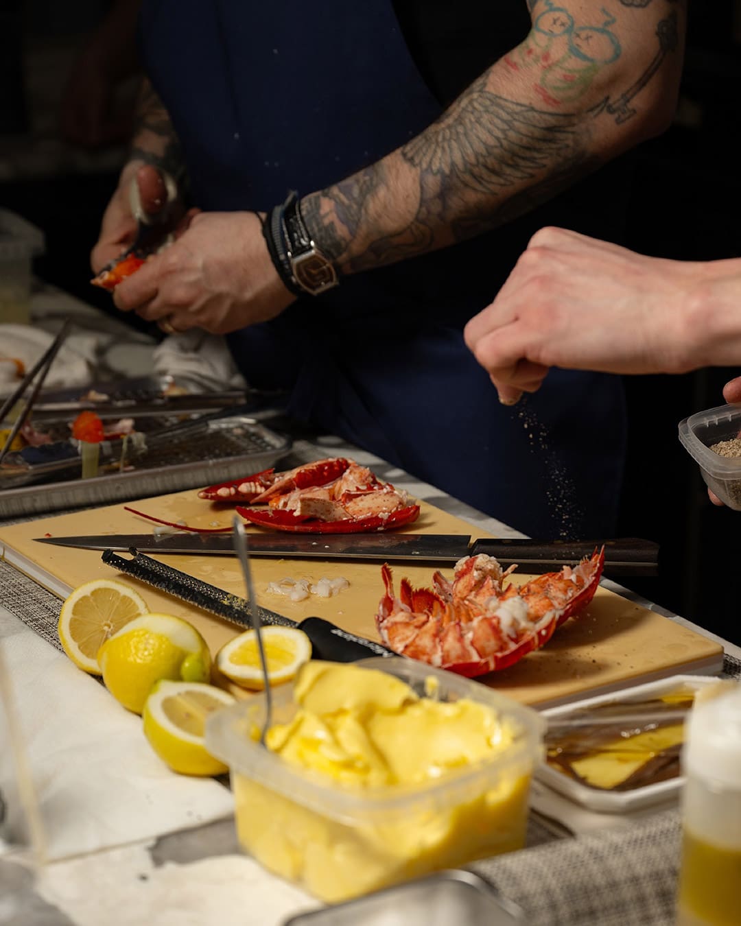 Chefs prepare seafood at Penny