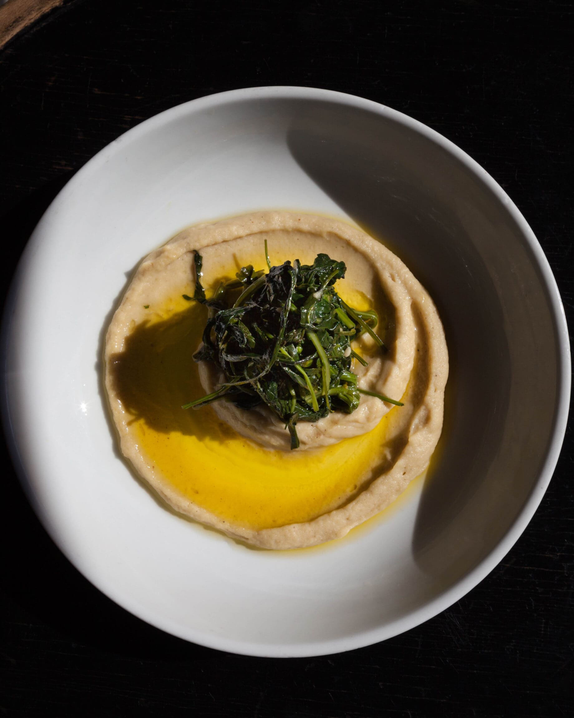 The best restaurants in New York City | Bean puree topped with sautéed spinach and drizzled with oil