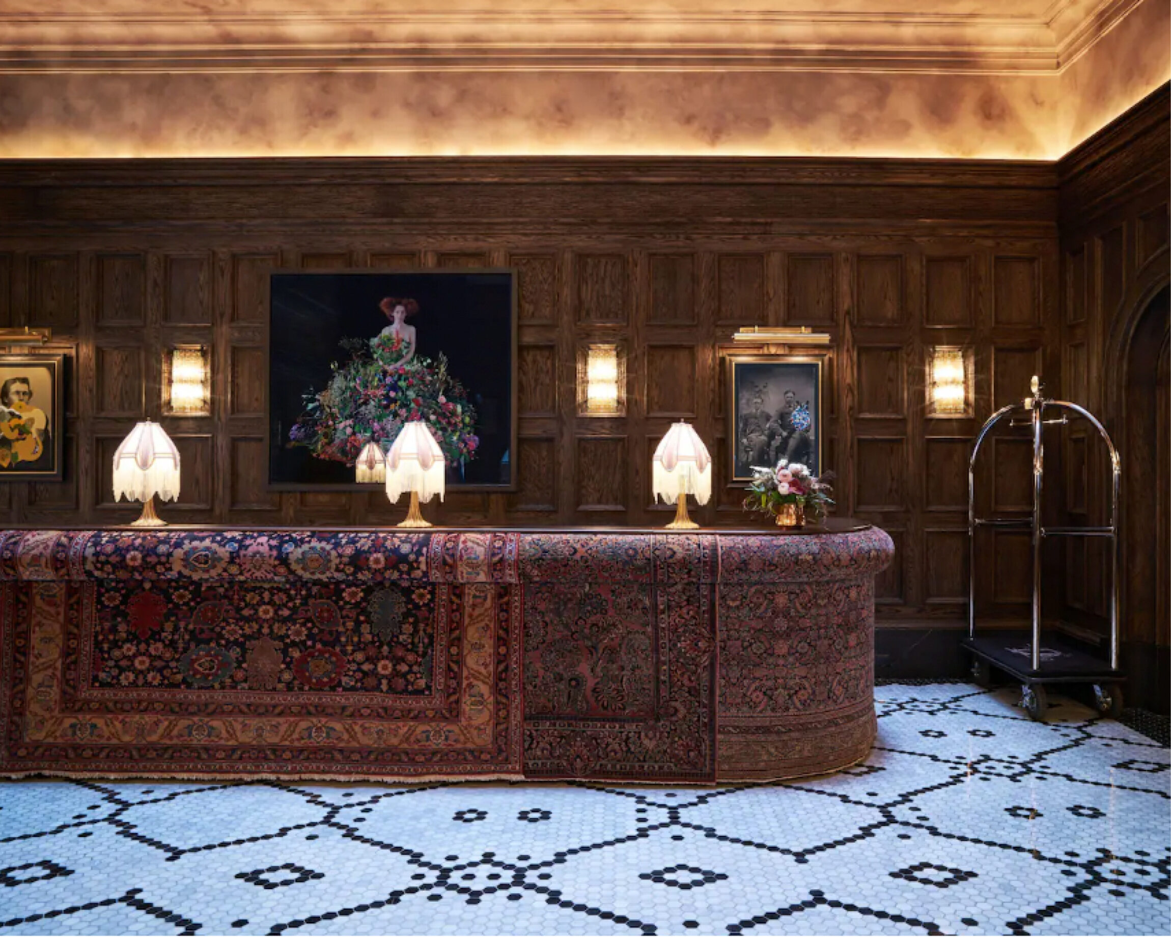 The best co-working spaces for remote working in New York City | The lobby of the Beekman with classic New York tile and run tapestry lining the reception desk.