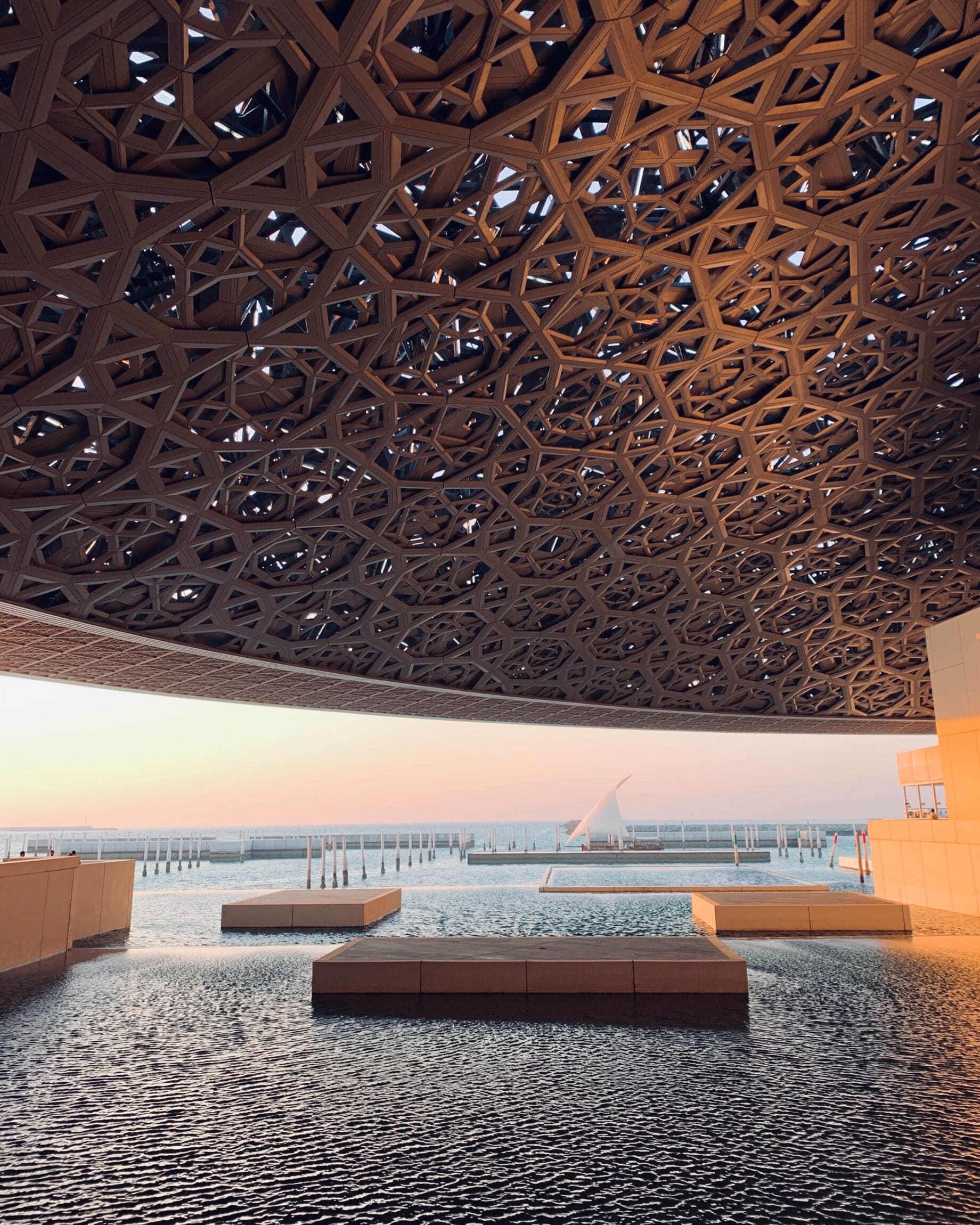 The best art galleries in Dubai | A detail of the laced dome that hangs over the Louvre Abu Dhabi