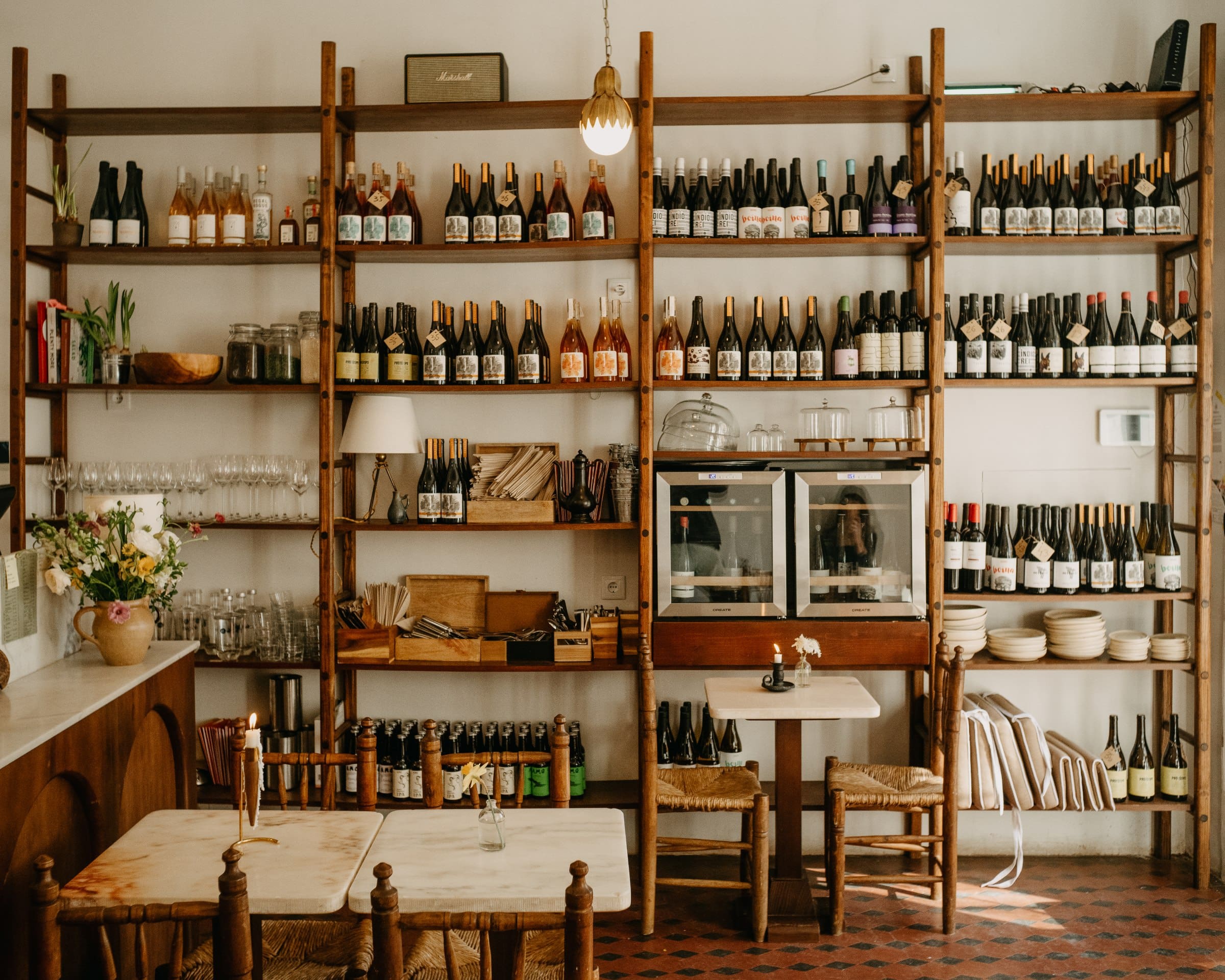 Rustic interiors and bottle-lined shelves at Magnolia Bistrot & Winebar
