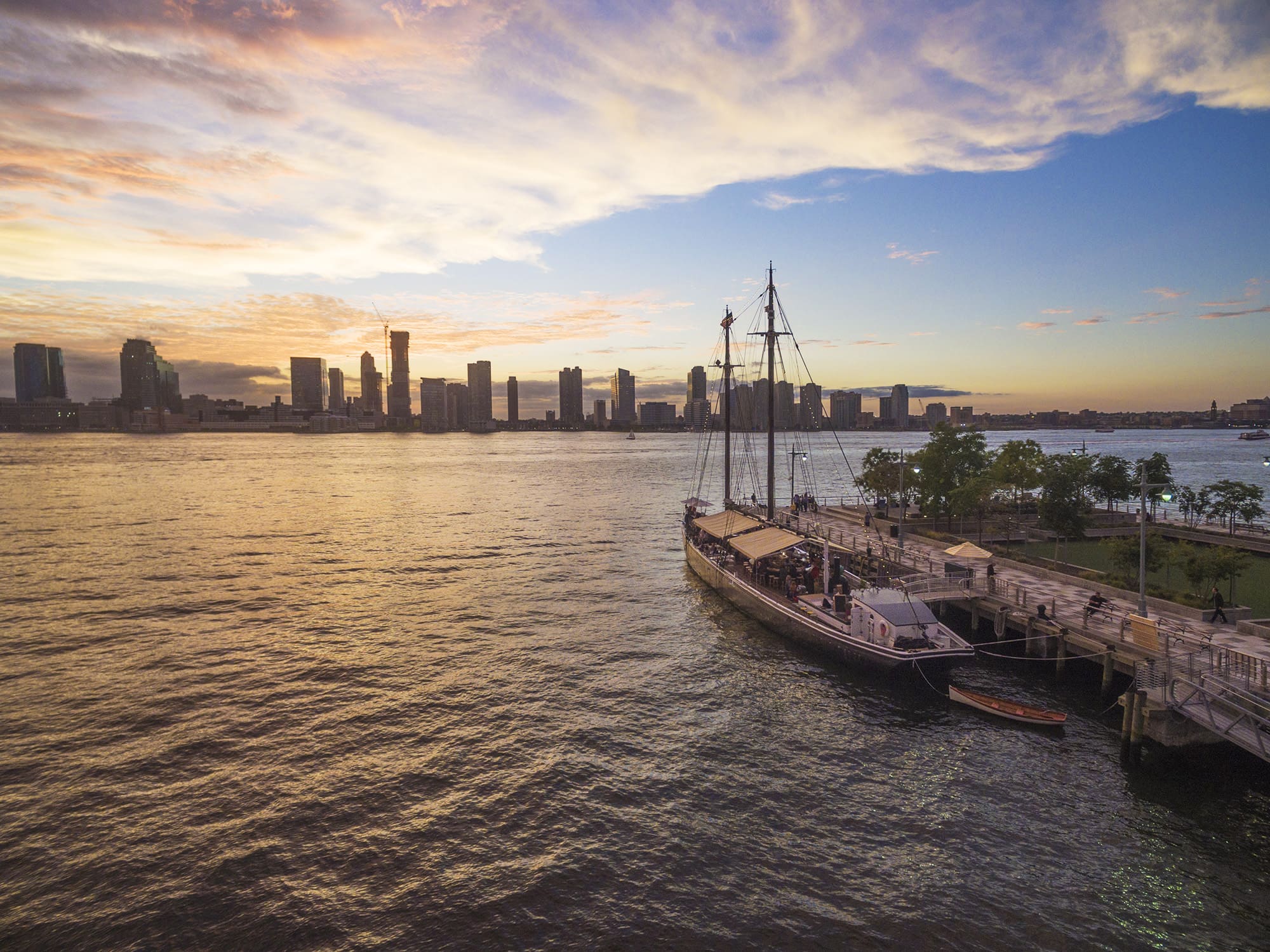 Floating oyster bar pictured on the Hudson River at sunset