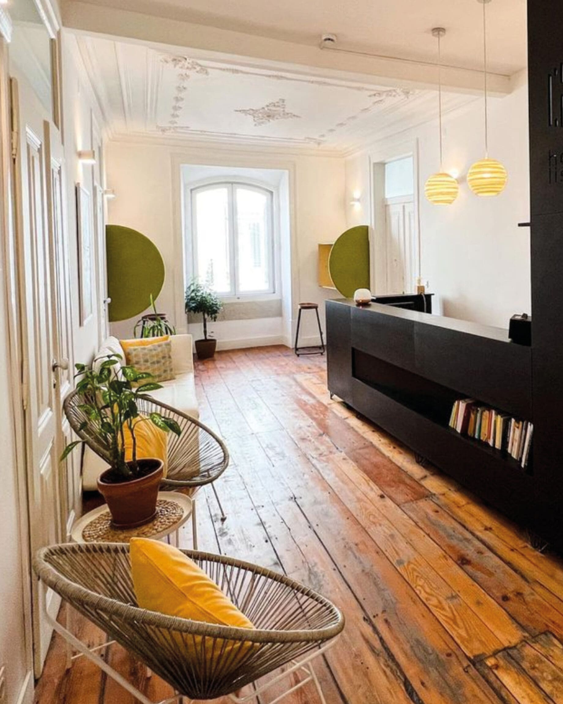 The best co-working spaces in Lisbon | wooden floors and a wicker chair at Heden