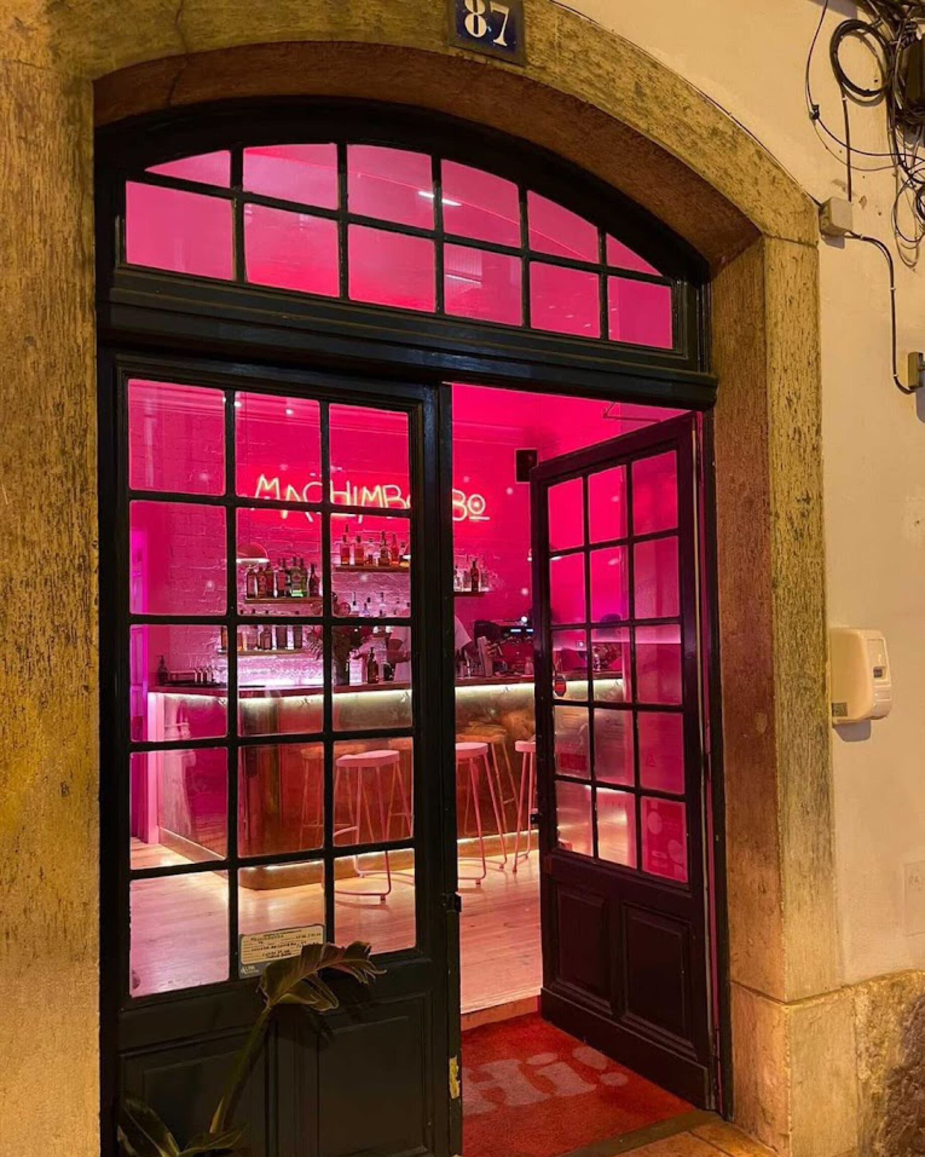 Pink interiors at Machimbombo bar in Bairro Alto seen from outside