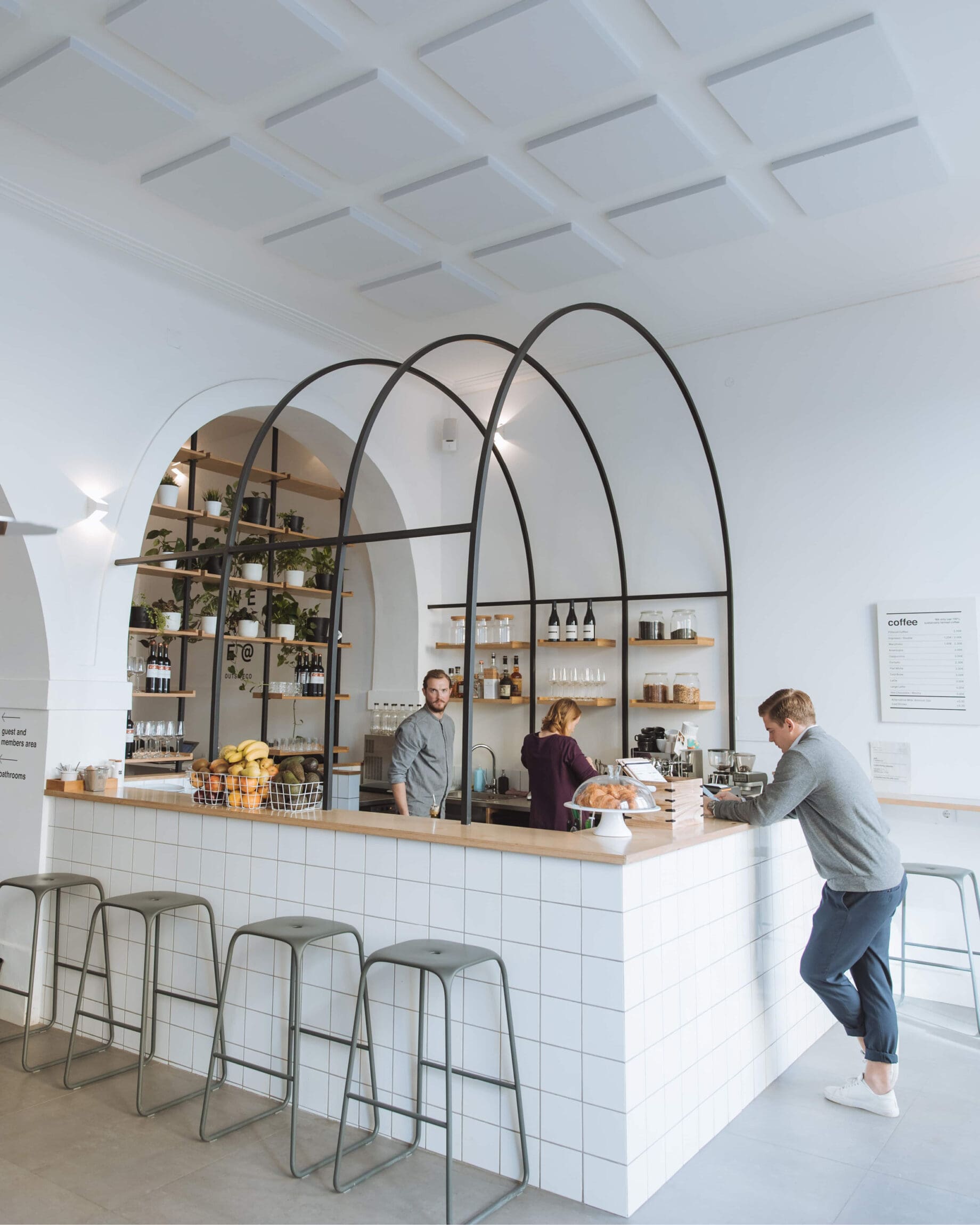 The best co-working spaces in Lisbon | a white central coffee bar at Outside