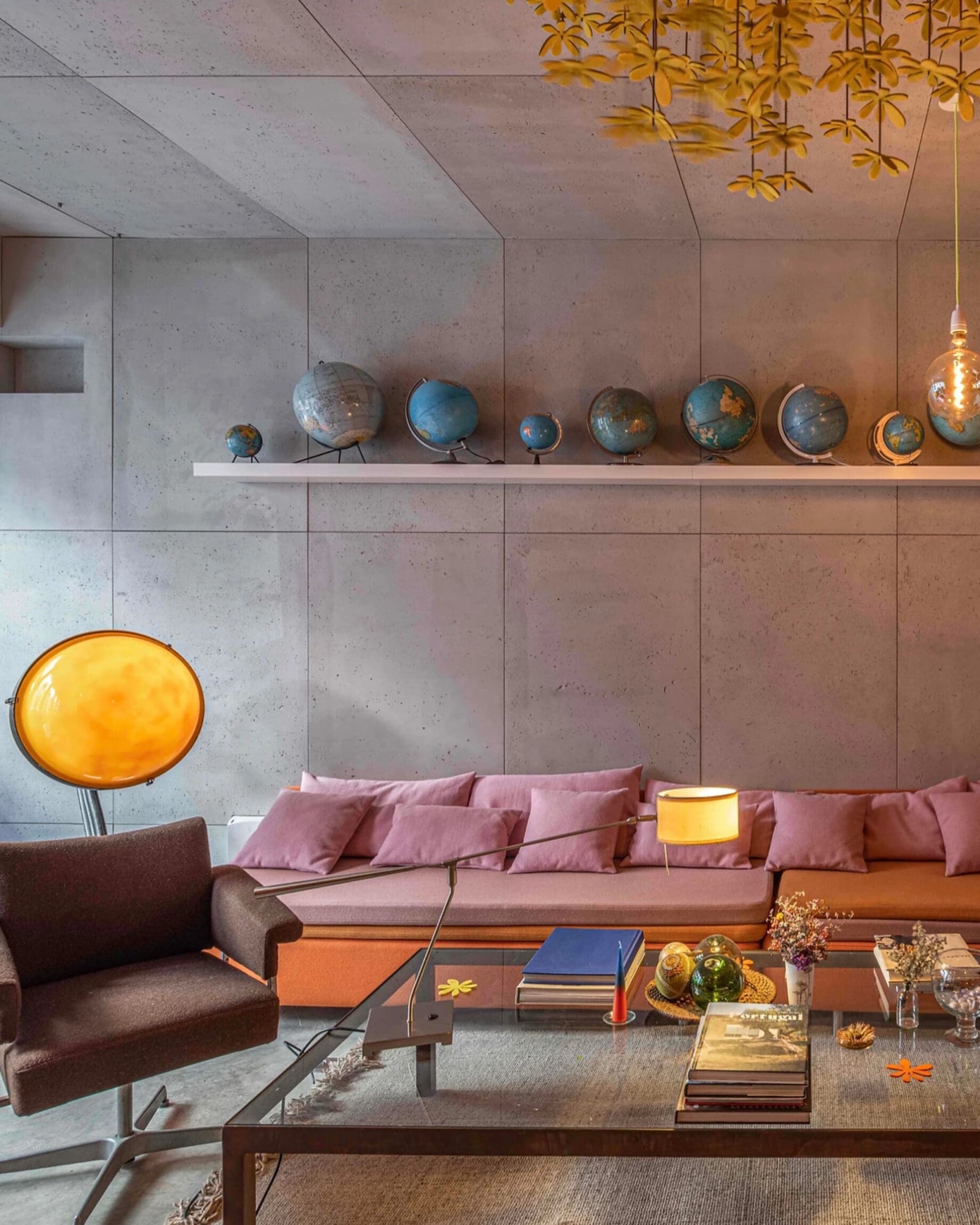 The best hotels in Lisbon | a pink sofa in a low-lit space at Toctoctoc