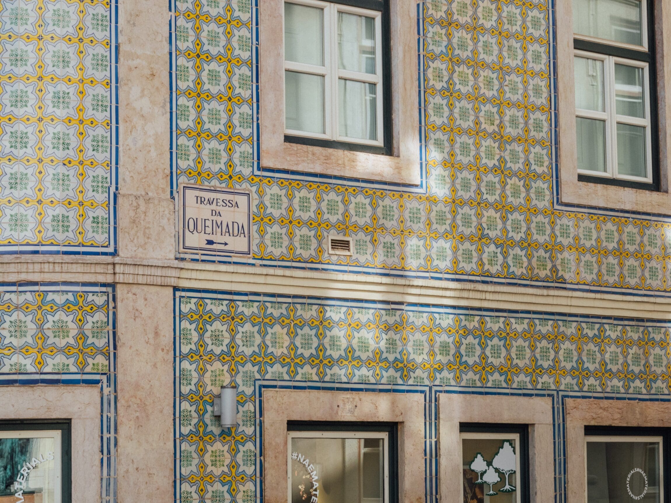 A local guide to Lisbon | tiled walls in mustard and blue tones, photography by Luca Dugaro