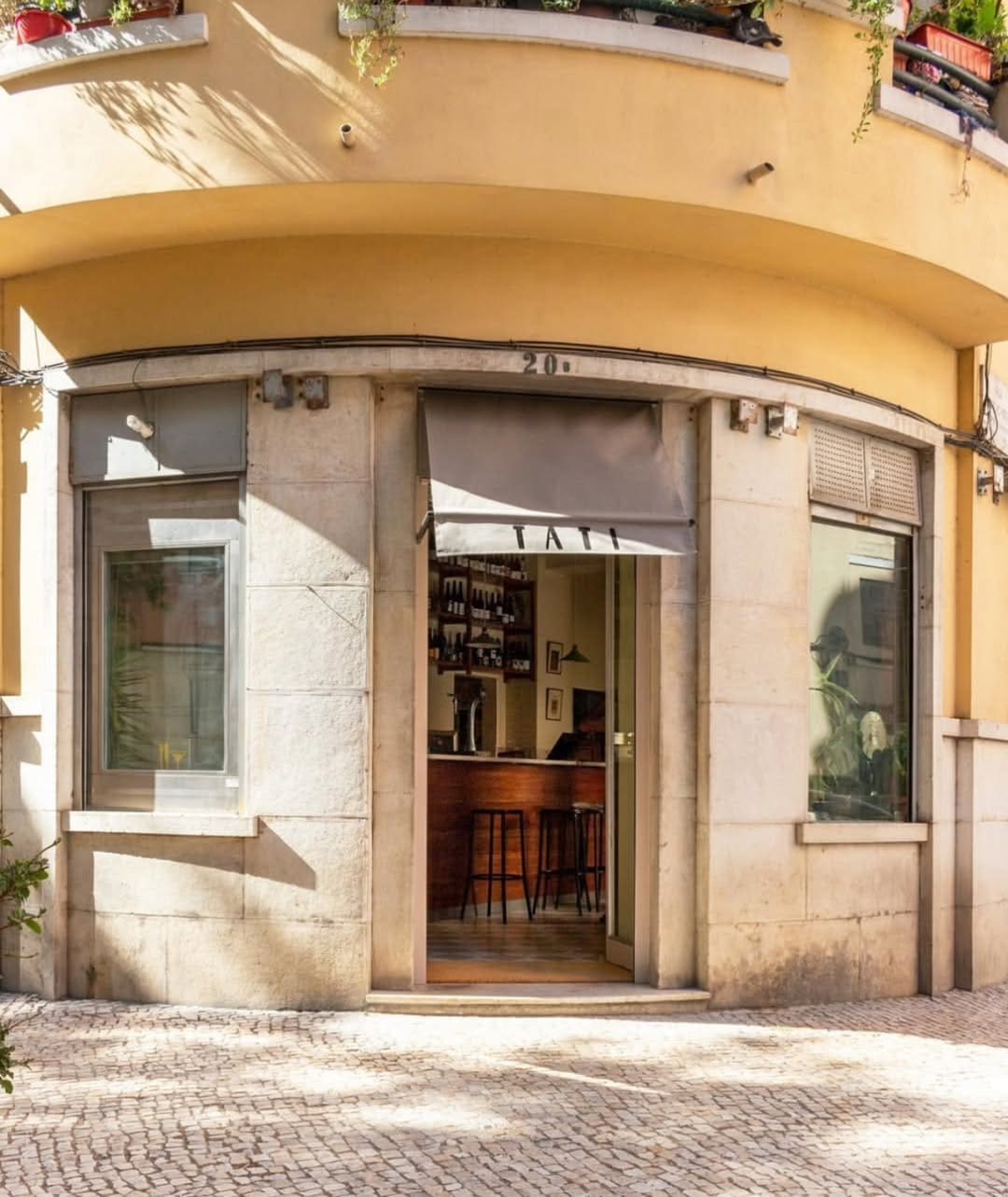 The sunny yellow exterior of Tati in Lisbon