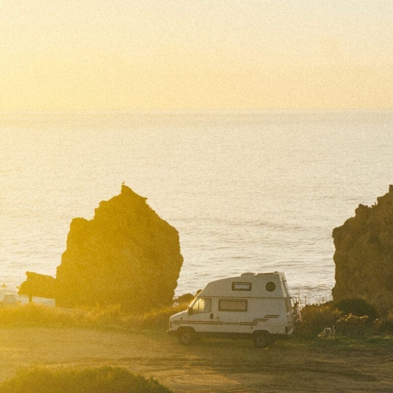 How is van life evolving? A fan against a hazy yellow sunset