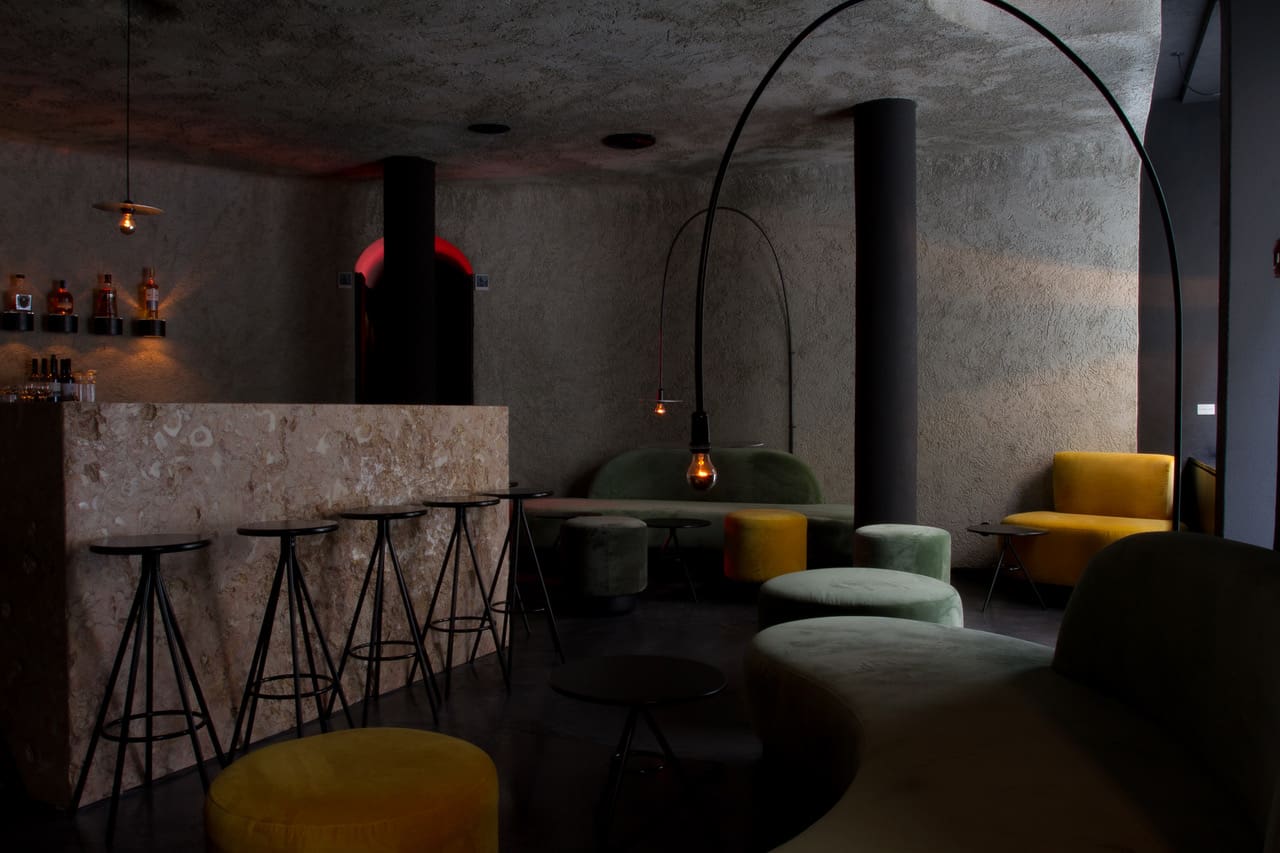 Concrete, low lit interiors at Toca Da Raposa in Lisbon