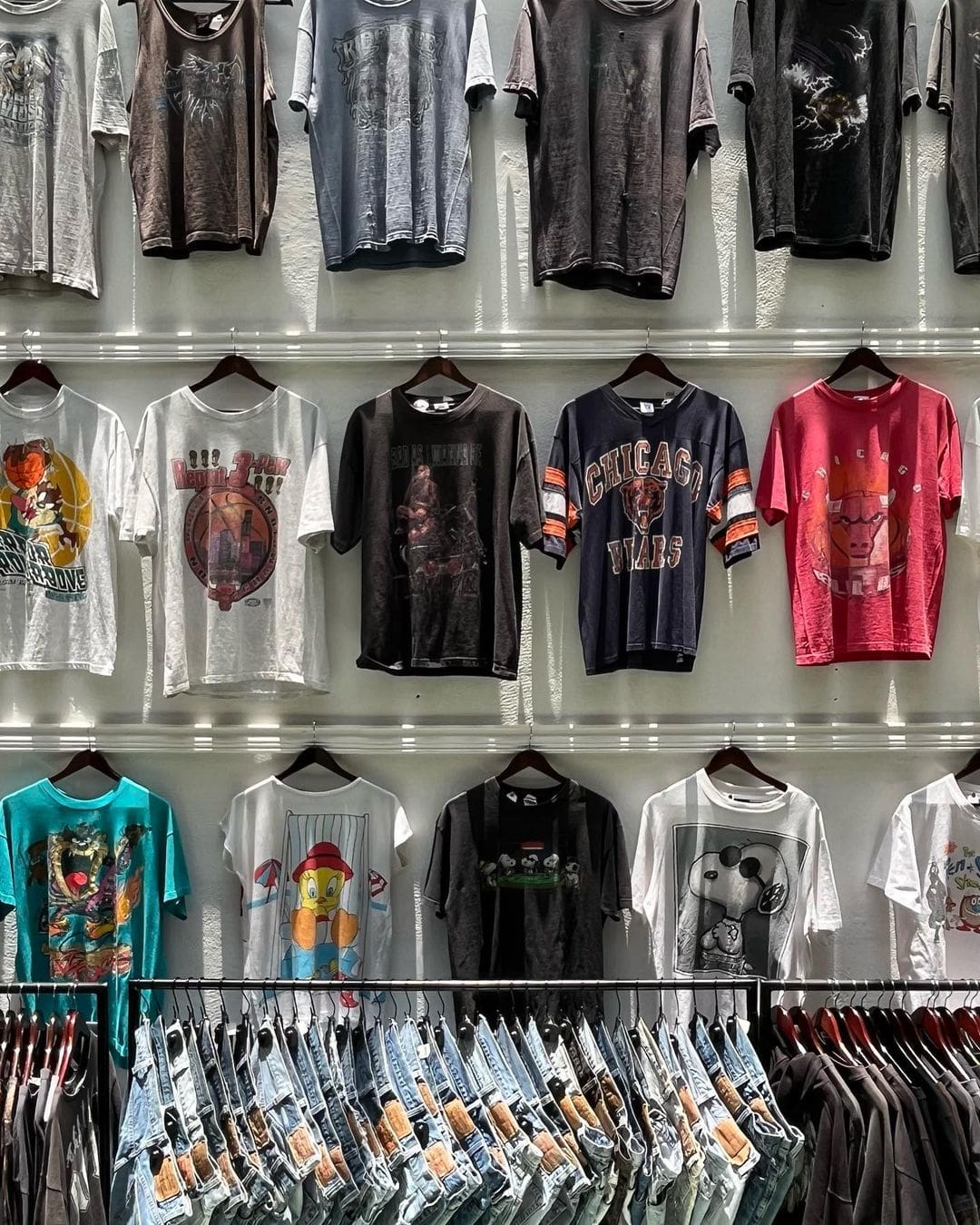 The best vintage shops in Mexico City | a wall of vintage T-shirts at Goodbye Folk