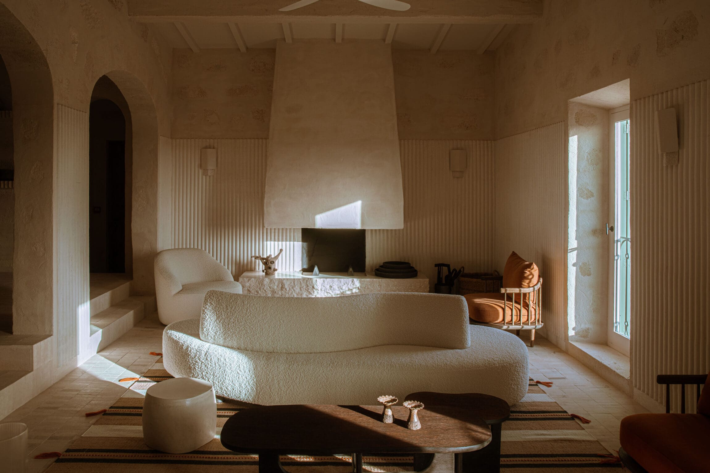 A boucle sofa and atmospheric light at Son Blanc Farmhouse, Menorca