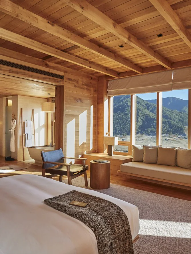 A bedroom at Six Senses Bhutan with mountain views