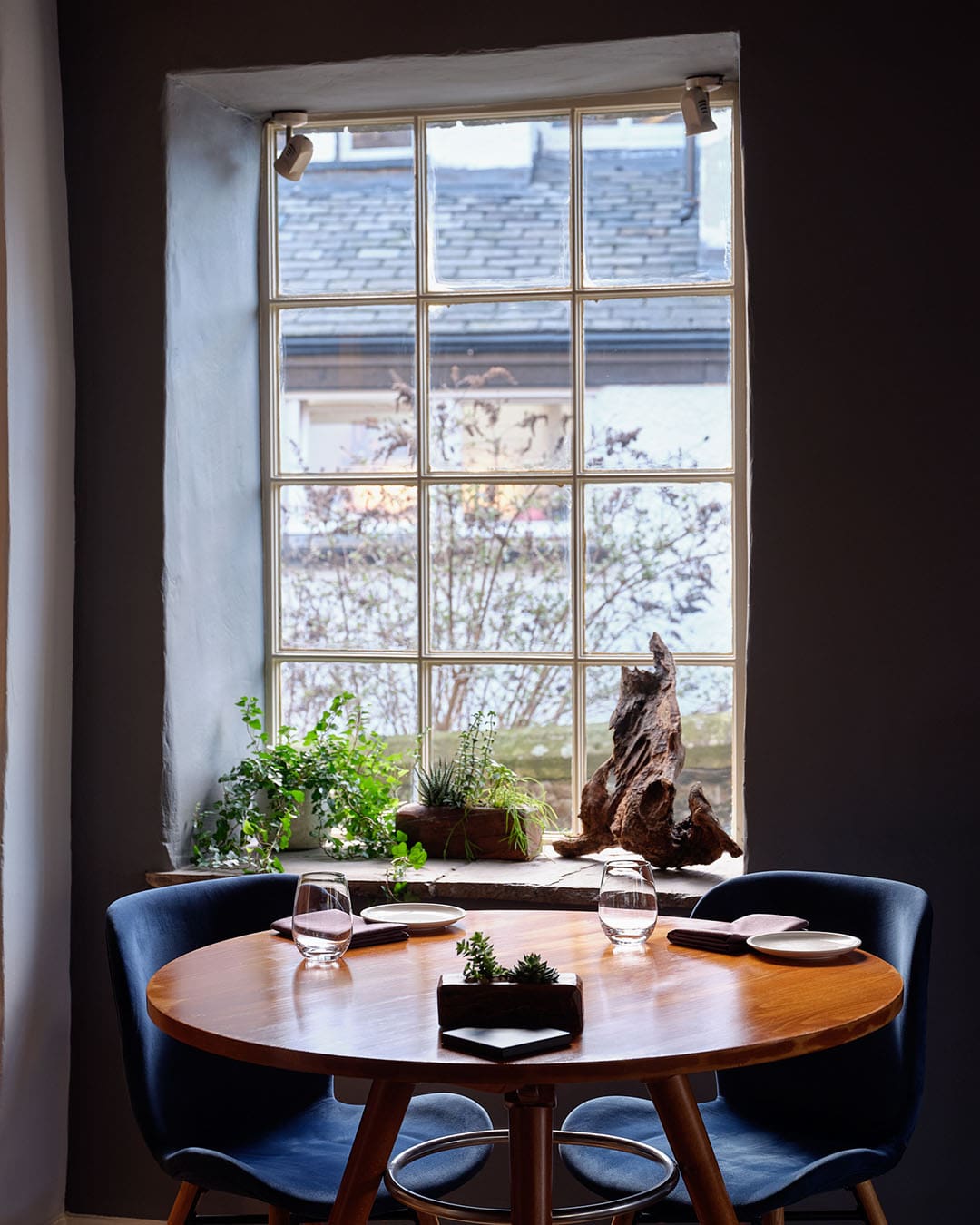 Dining room in Rogan & Co with place settings and view to the outside