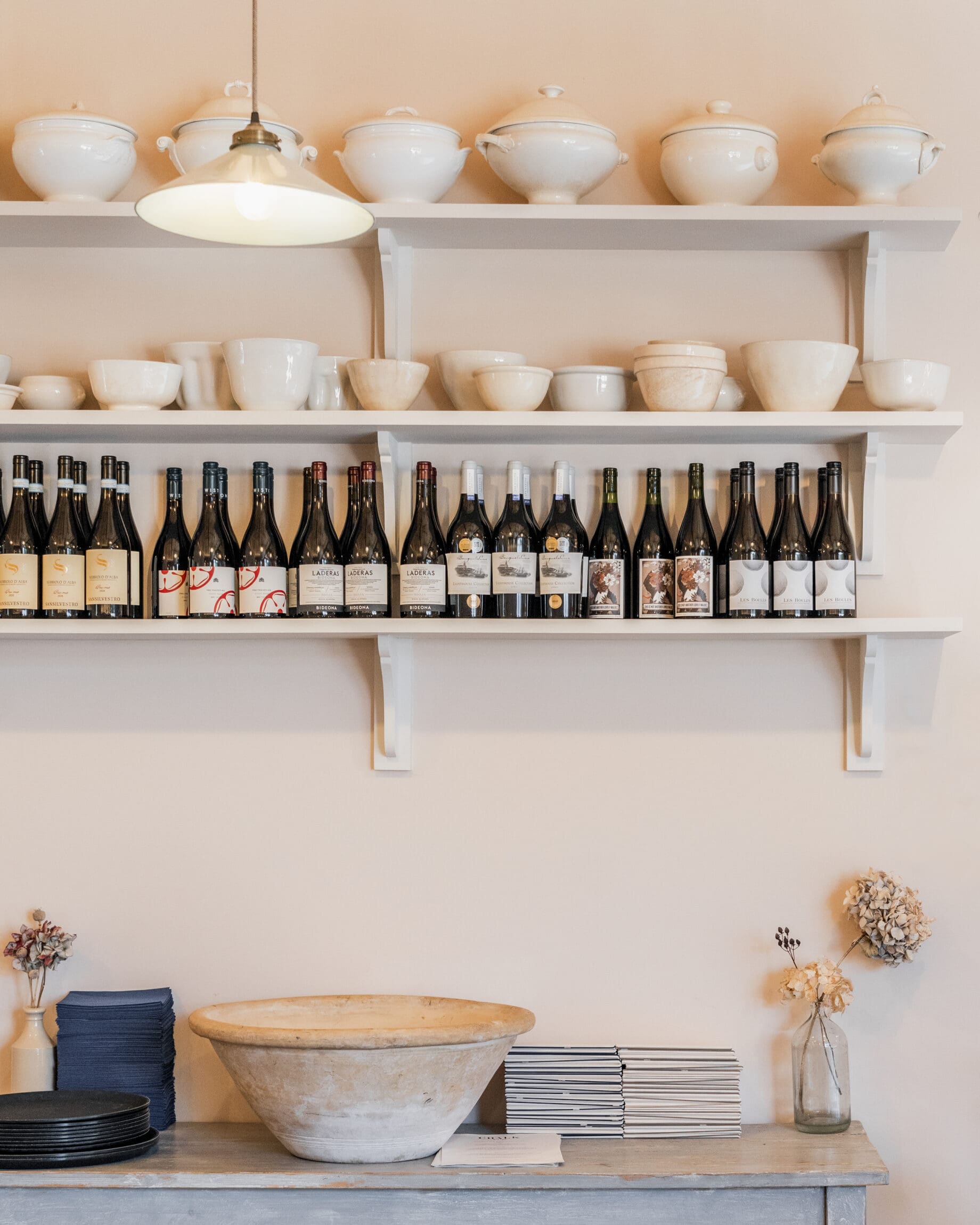 The best farm-to-table restaurants in the UK | Bottles lined on a neutral shelf at Chalk, Wiston Estate