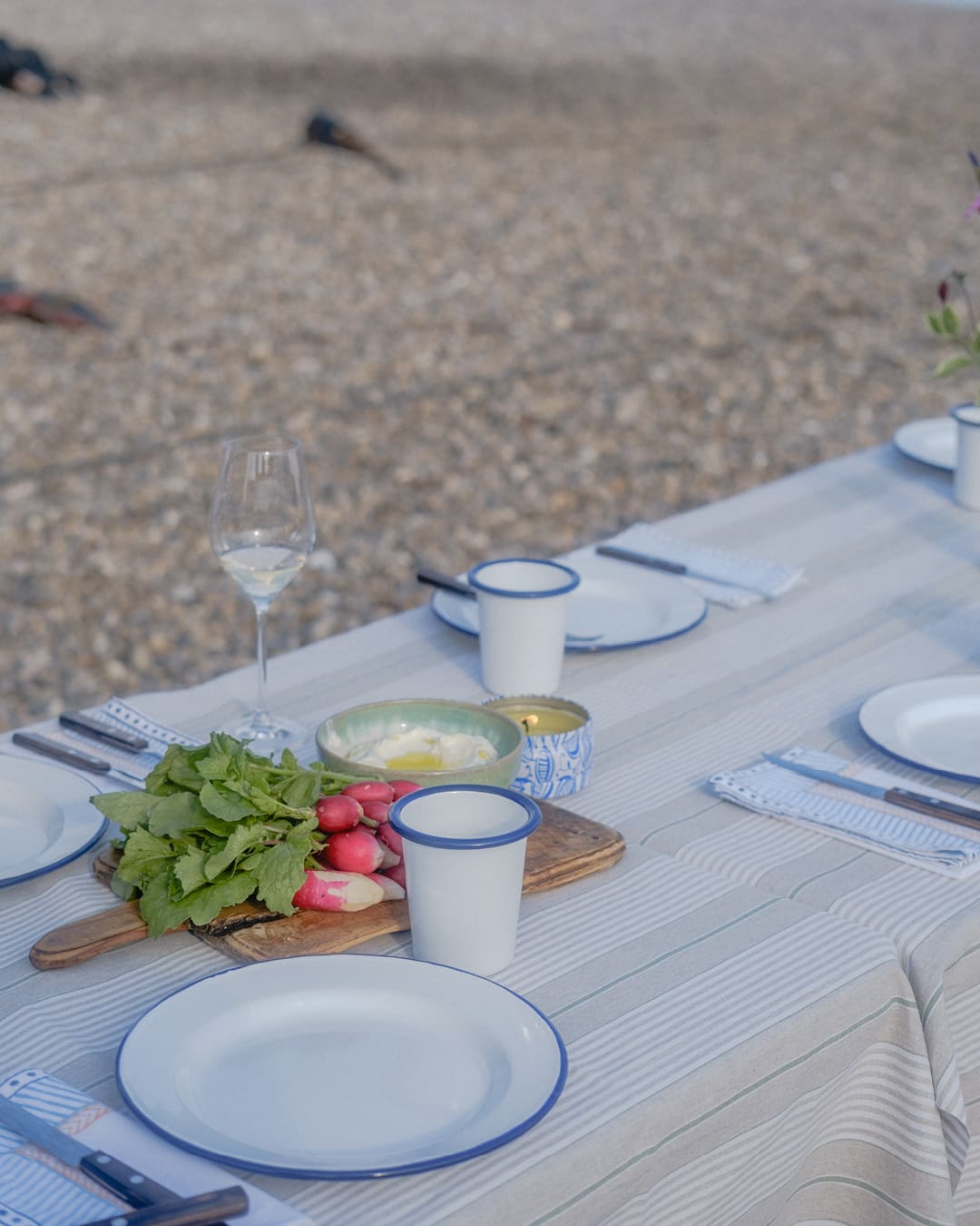 The best farm-to-table restaurants in the UK | A table ready for dinner on a beach near Glebe House.