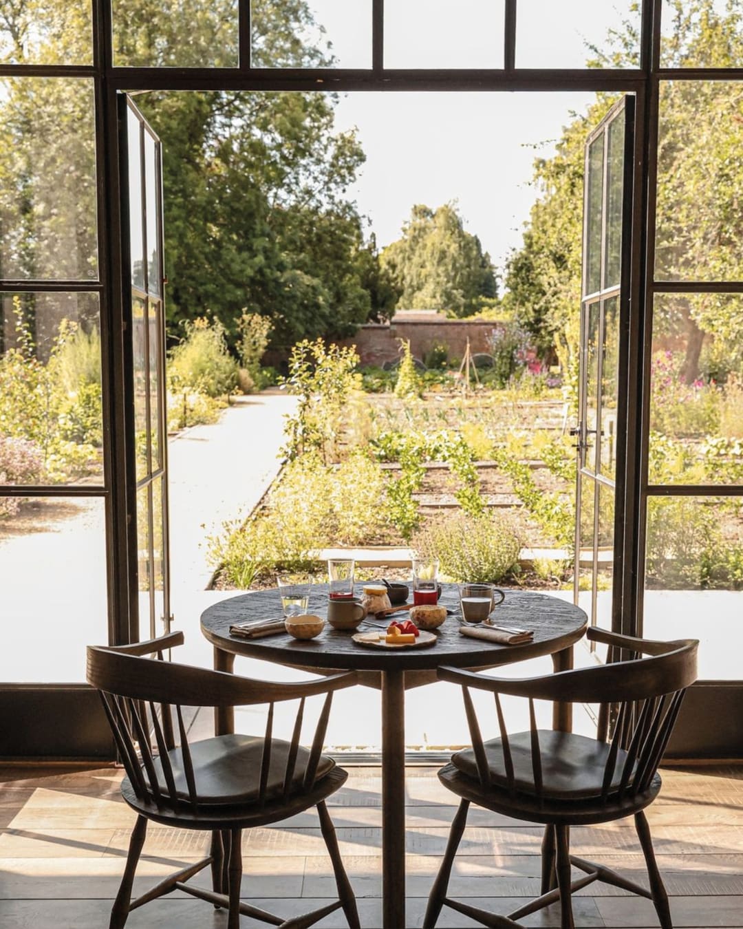 The best farm-to-table restaurants in the UK | A table for two facing the walled garden at Grace & Savour.
