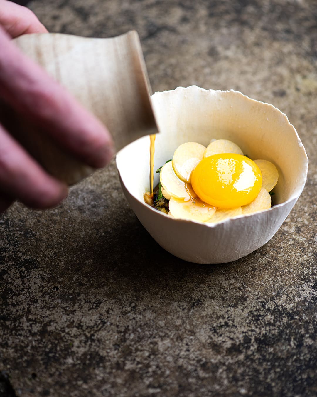 The best farm-to-table restaurants in the UK | Beans, turnip and confit egg yolk served in their restaurant.