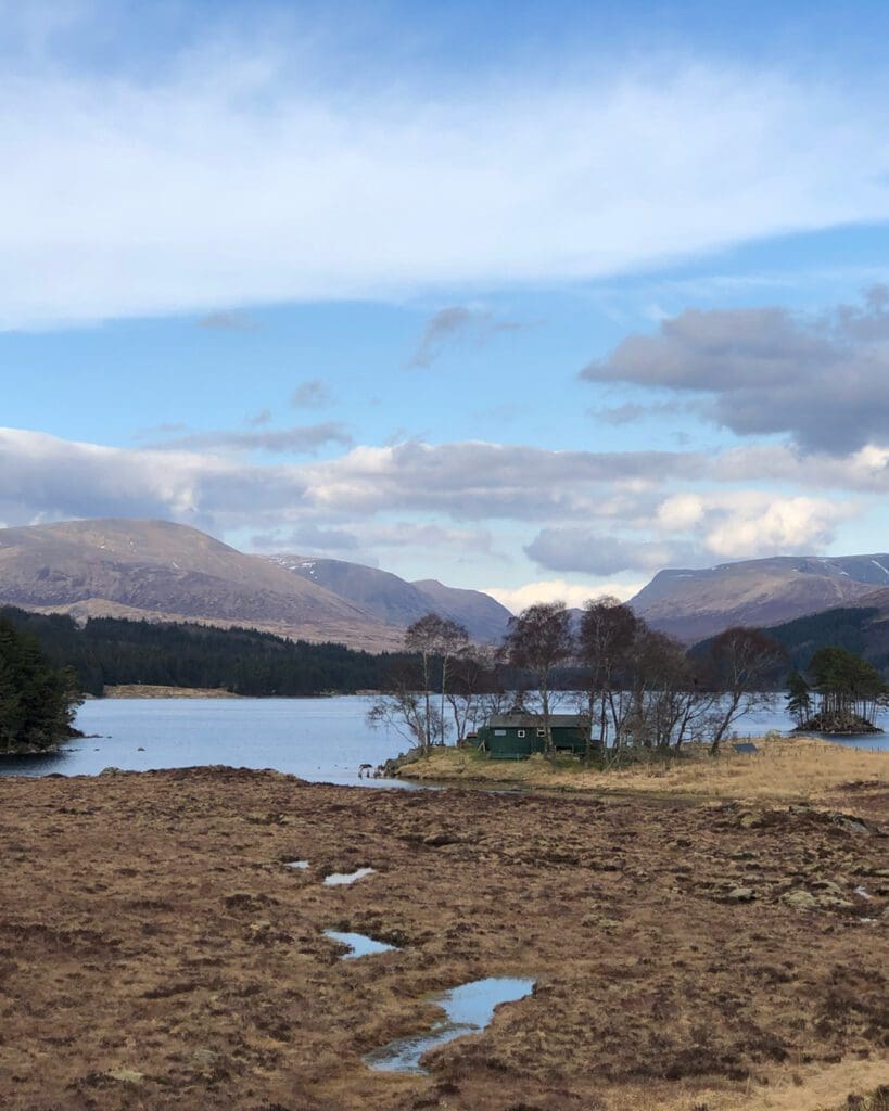 The rise in off grid adventure travel | Loch Ossian Youth Hostel nestled in trees beside the loch