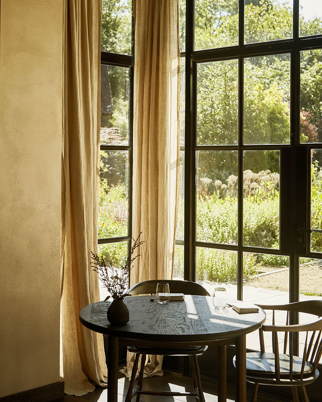 Table and chairs with view overlooking garden