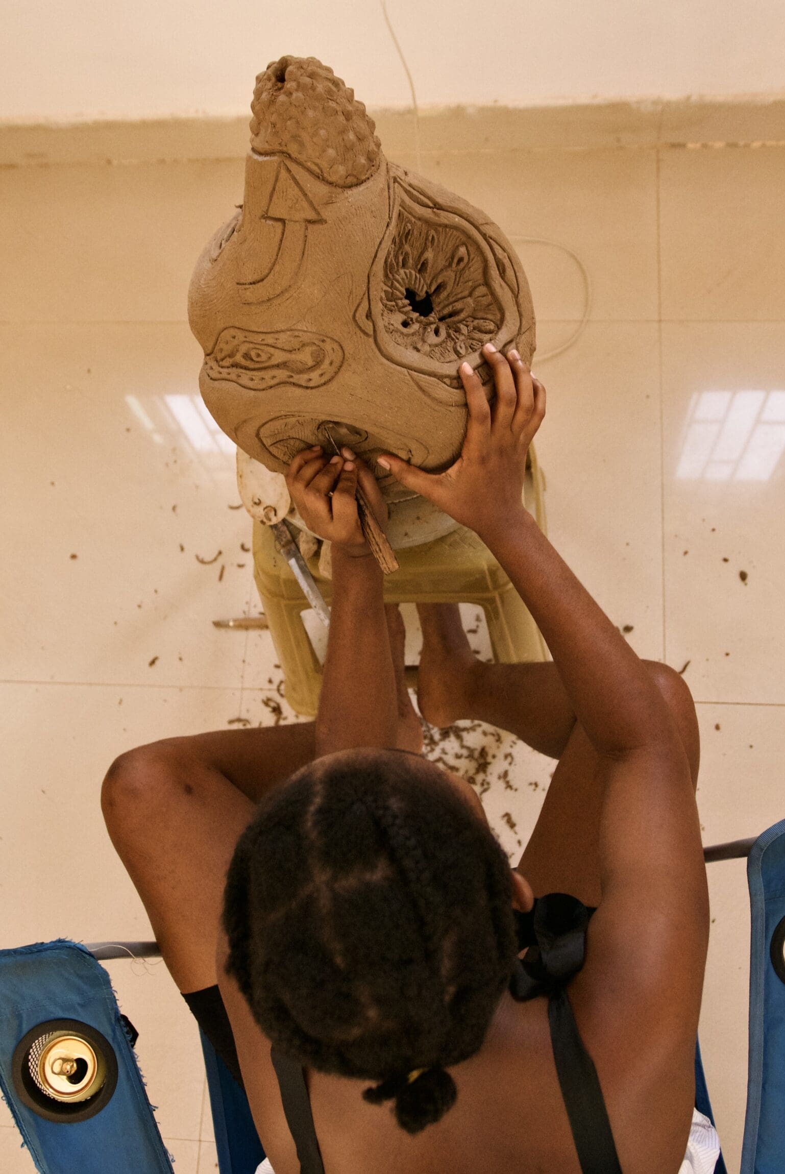 Olubunmi Atere working on a ceramic sculpture.