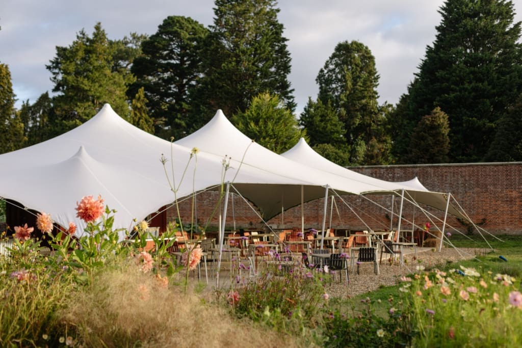 The best farm-to-table restaurants in the UK | An awning shelters the terrace in the walled garden at Water Lane.