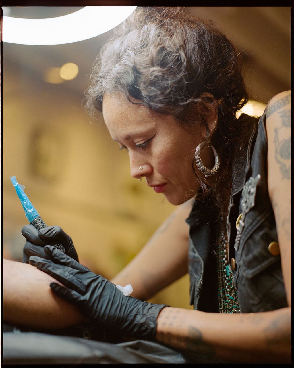 An interview with Tati Compton | Tati tattooing in her LA studio