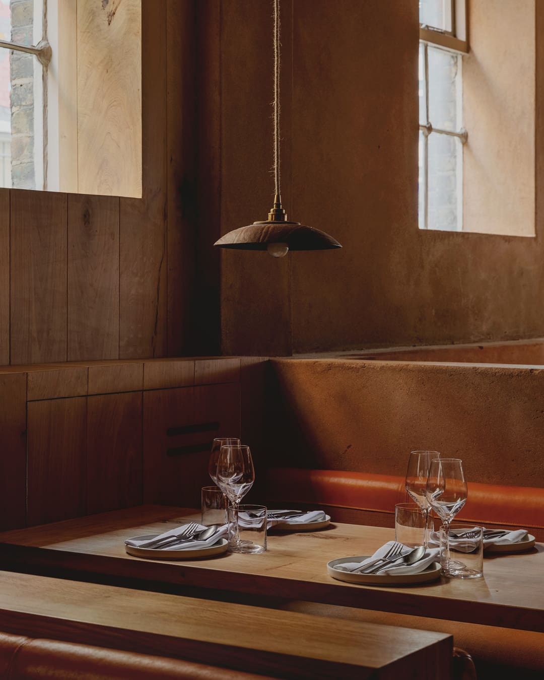 The best restaurants in Shoreditch and Spitalfields | pared back interiors at Manteca in brown tones