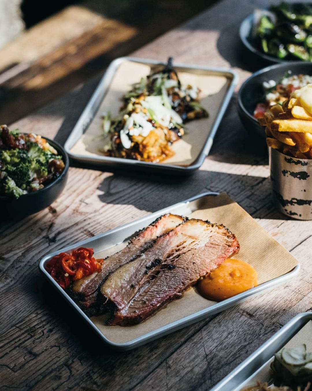 The best restaurants in Shoreditch and Spitalfields | a meat dish served outside at Smokestak