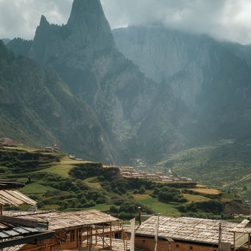 Mountains preside over a traditional Tibetan village