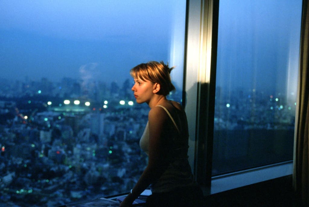 Scarlett Johansson looking at Tokyo through a hotel window in Lost in Translation, 2003