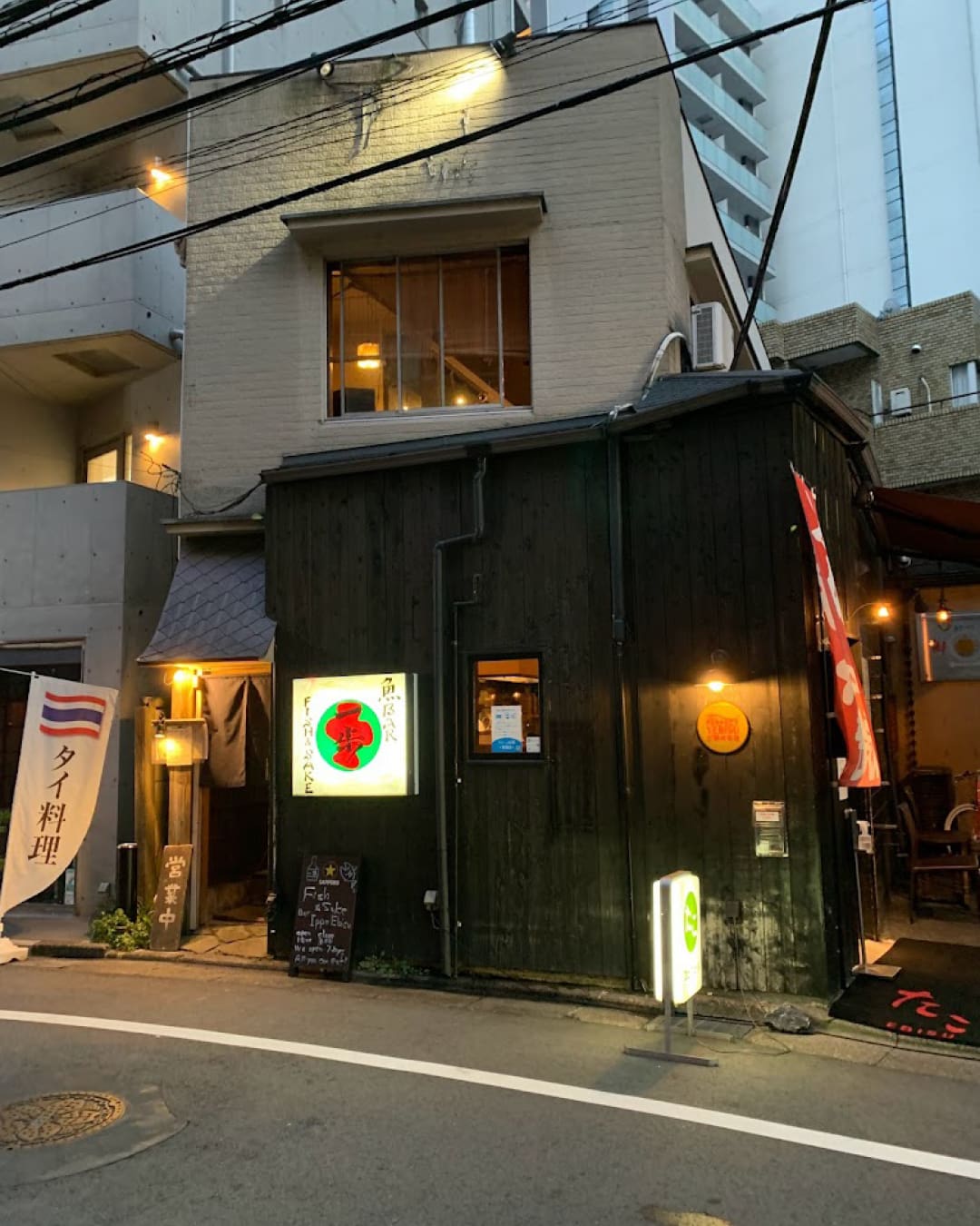 The best izakaya in Tokyo | the exterior of hip Ippo bar with colourful signage