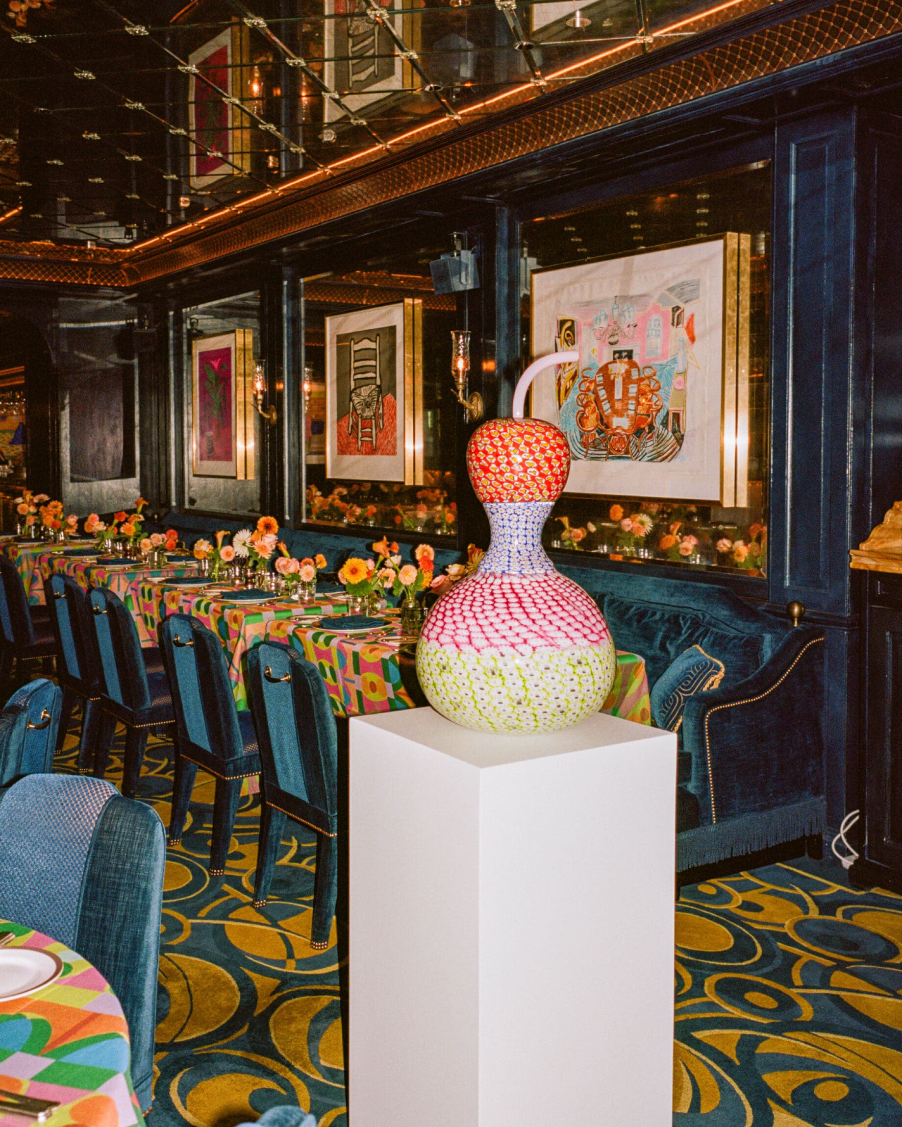 Yinka Ilori on the importance of joy and affirmation in his practice | Yinka Ilori's original murano glass sculpture on a plinth inside Mayfair private member's club George.