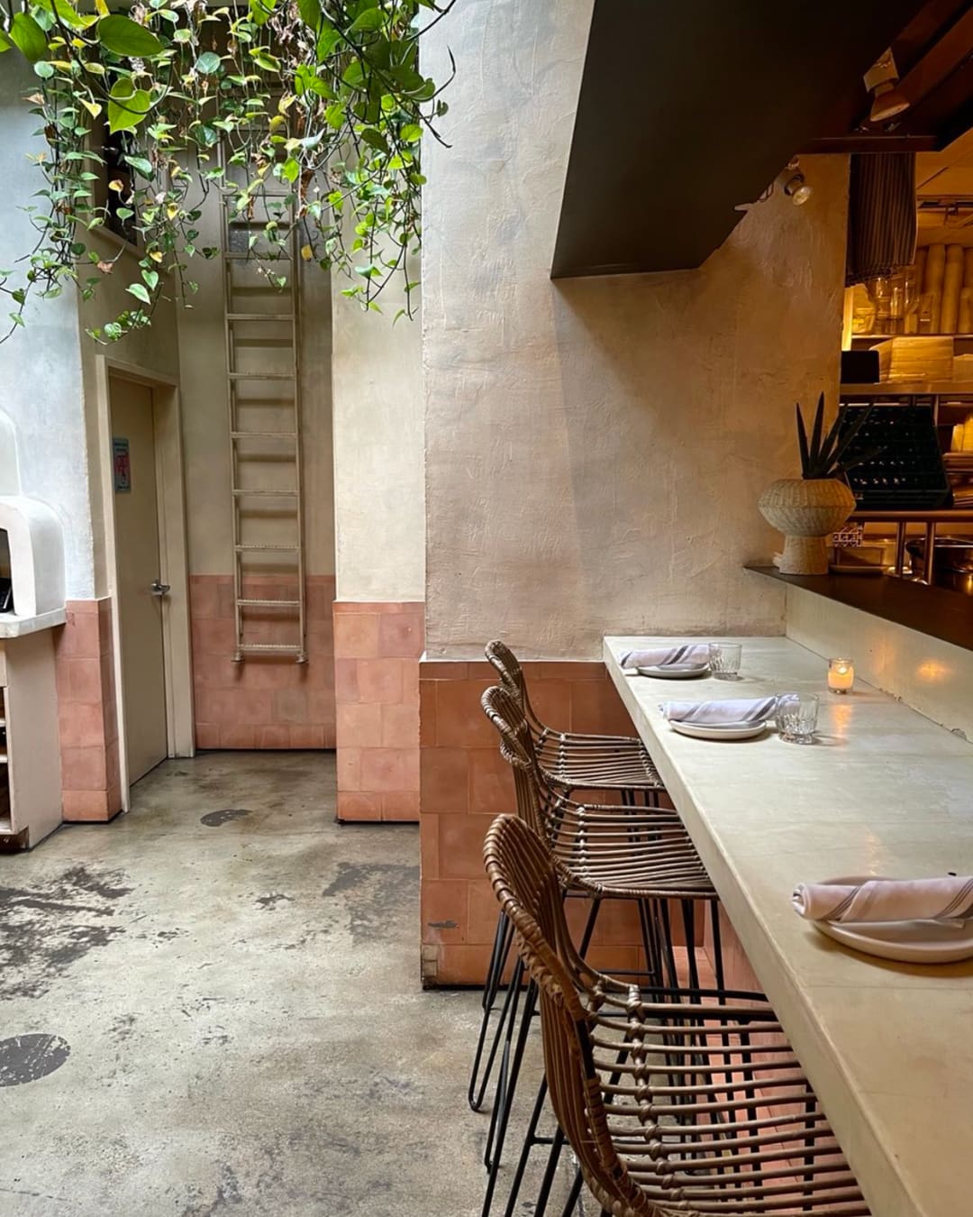 The best restaurants in Greenpoint NYC | White-washed walls and concrete flooring at Oxomoco