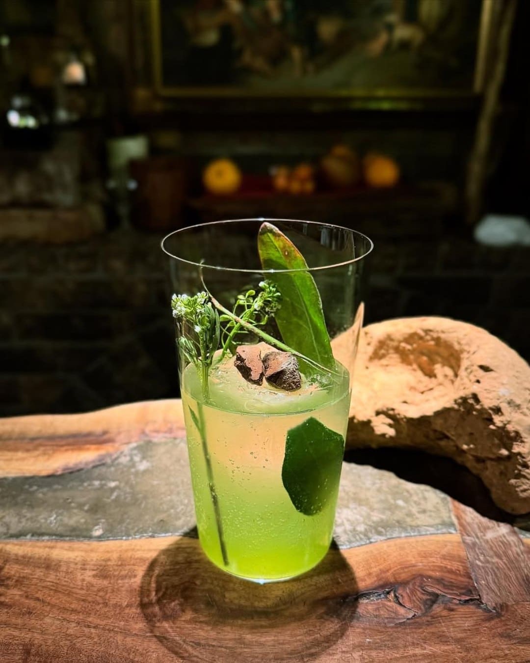 A green drink garnished with wild herbs from the BenFiddich Farm