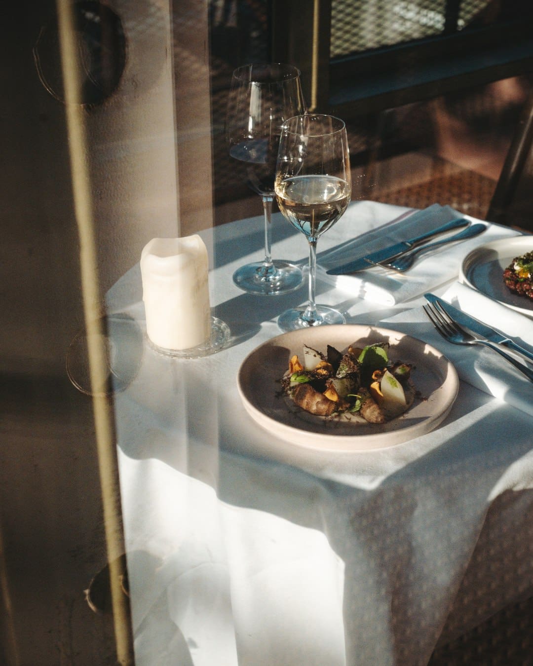 A glass of wine and a dish at Helling 7 in Amsterdam
