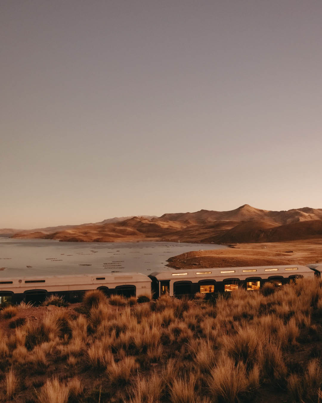 A Belmond train driving through Peru