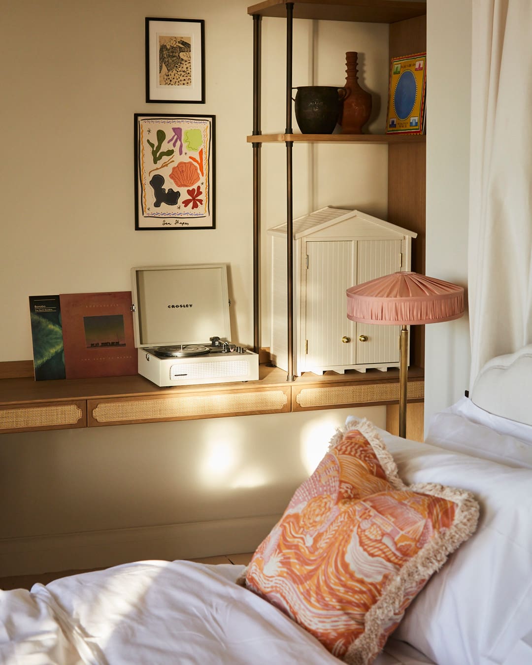 A cosy bedroom with peach furnishings at No.124 by GuestHouse, Brighton