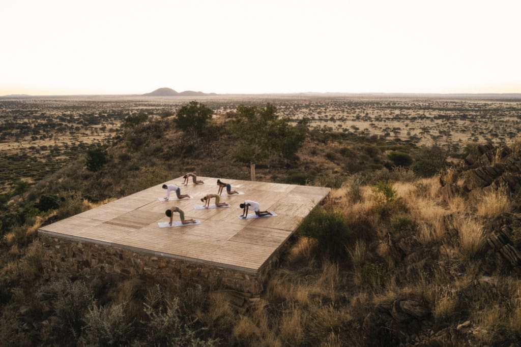 Yoga on an outdoor deck, ensconced in nature, at Our Habitas Namibia