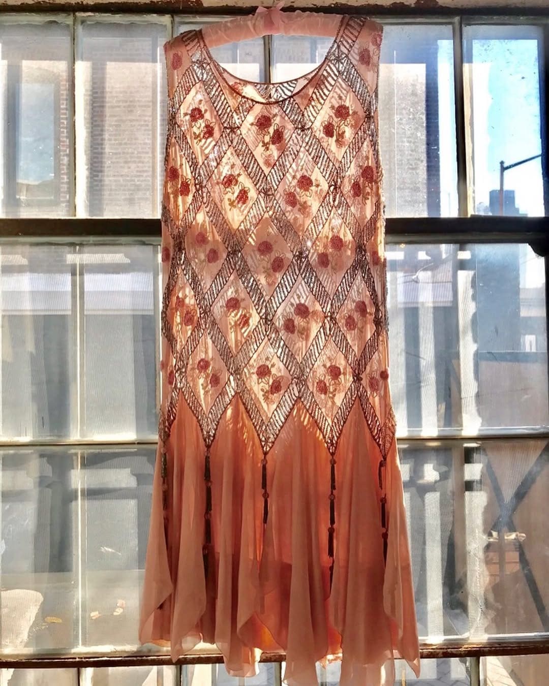 A beaded silk chiffon flapper dress hanging in Stella Dallas Living, New York