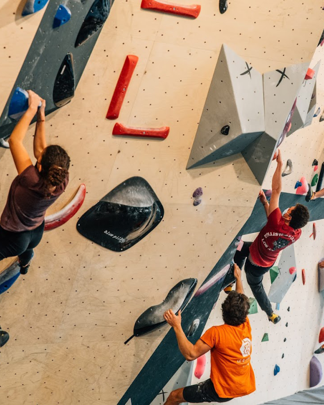 The best co-working spaces in Paris | Climbers tackle the bouldering wall at Climbing District.